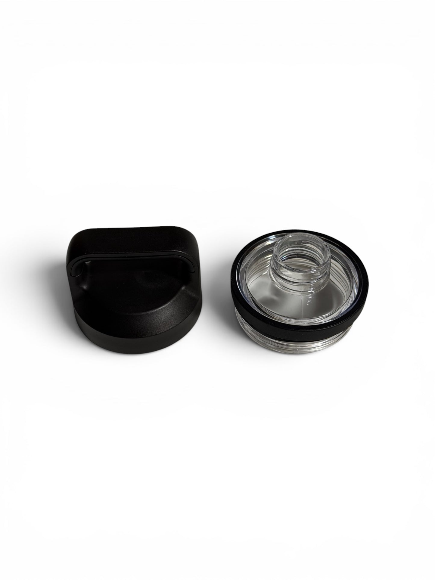 Black and clear plastic screw on lid components on a white background