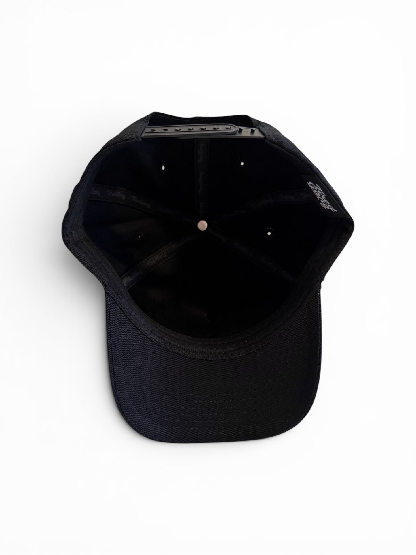 Bottom view of black cap on a white background